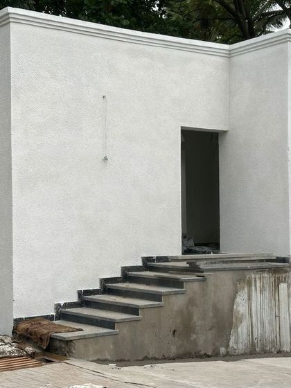 An earlier construction photo of the same building, before the final finishes were applied.