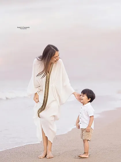 A quiet moment between a mother and her son on the beach at sunset. The soft light and serene background make for truly magical and emotional portraits.