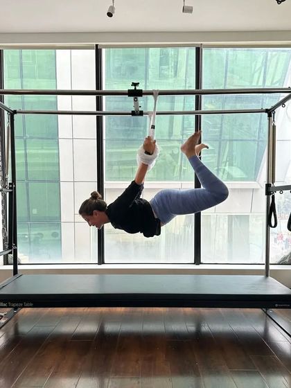 Stretching into the weekend with a graceful hanging pose on the Cadillac. This is a great way to decompress the spine and feel lengthened.
