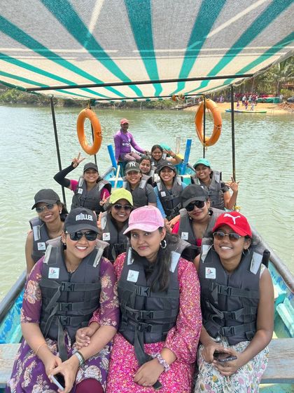 A cheerful group of women on a boat tour during our coastal summer trip.