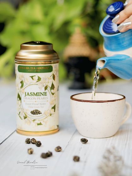 A story in a pour. This action shot captures hot water being poured into a cup for jasmine tea. The simple, rustic styling and soft light create a feeling of calm and tranquility.