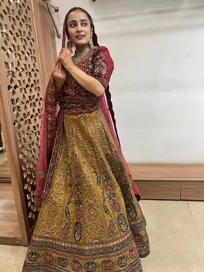 A beautiful pose showcasing the full glory of this traditional yet unique bridal lehenga.