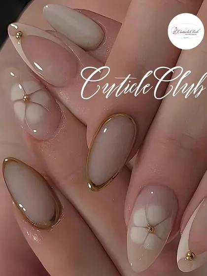 For a chic and minimalist style, I designed these nude nails with subtle details. The look features a delicate gold border on some nails and a simple, elegant floral line art on others, centered with a tiny gold bead.