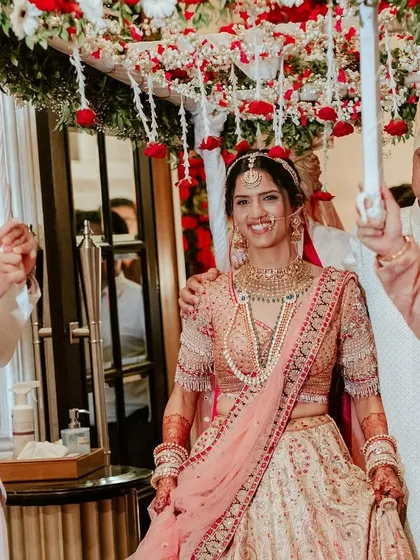 The bride's entry is a moment for the whole family. Here, she is escorted by her father and brothers under a beautiful 'phoolon ki chaadar'.