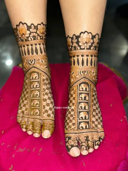 Intricate bridal foot mehndi featuring a procession of elephants. The design is perfectly symmetrical, with a border of lotus petals, ensuring the bride looks stunning from head to toe.