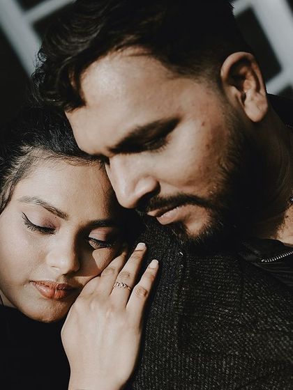 A close-up of a tender embrace, focusing on the emotion and connection between the couple.