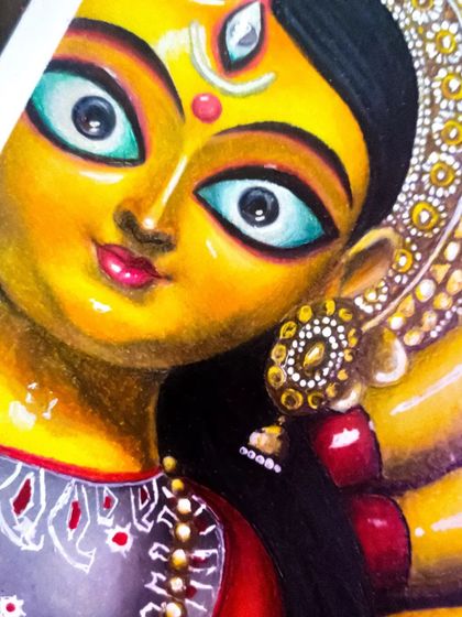 A close-up on the face of my Durga Maa drawing, highlighting the detailed eyes and traditional jewelry.