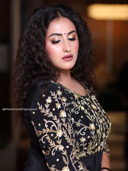 A close-up on the HD makeup for this look. I used warm tones and a soft smokey eye to create depth and drama, while keeping the skin looking flawless.