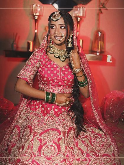 A happy bride is the most beautiful bride. This stunning pink lehenga with intricate silver work is sure to make you smile on your special day.