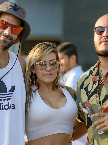 A cool group of guys enjoying the sundowner vibes at the pool party.