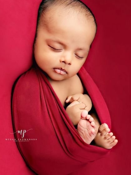 A tiny tongue pokes out in this adorable sleeping portrait.