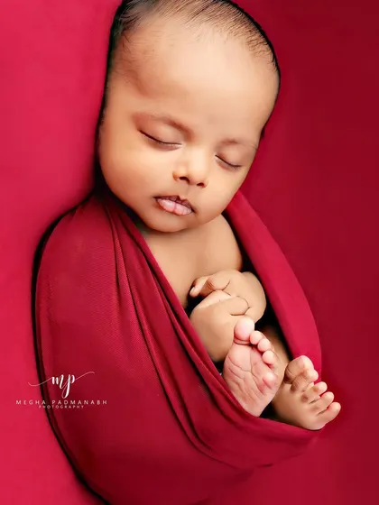 A tiny tongue pokes out in this adorable sleeping portrait.
