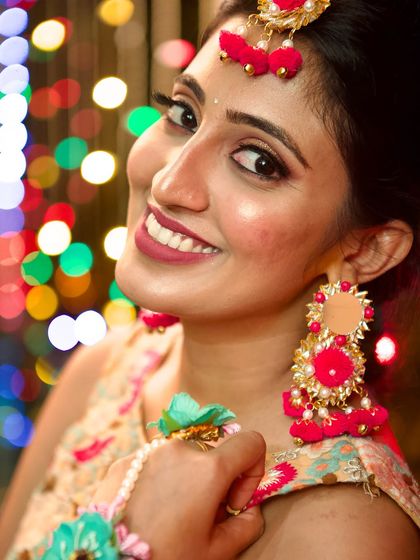 A happy and radiant portrait of my client at her mehendi. The makeup is designed to be picture-perfect, with soft, glowing skin and beautifully defined eyes.
