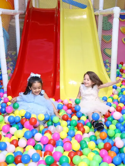 Our giant ball pit and double slides are always a huge hit. It's a colorful sea of fun where kids can dive, slide, and laugh together in a safe, soft-play environment.