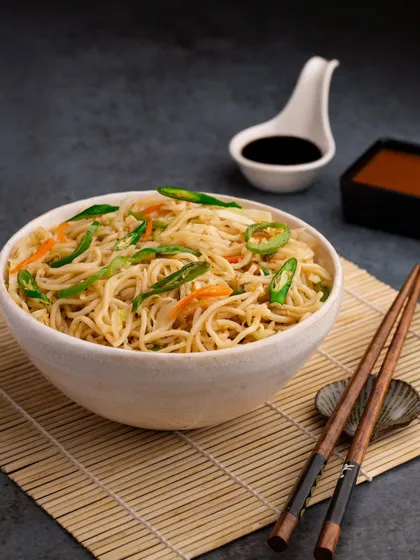 Chilli Garlic Noodles shot for Bombay Diner. We used chopsticks and traditional Chinese soup spoons to create an authentic feel for this popular dish.