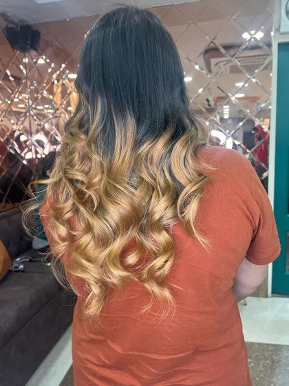 A final shot of the blonde ombre, perfectly curled and full of volume. This is a look that is guaranteed to turn heads.