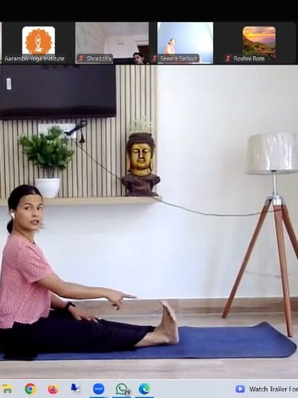 A demonstration of Paschimottanasana (Seated Forward Bend). This deep stretch is known for its calming effects, making it a key posture for stress relief and introspection.