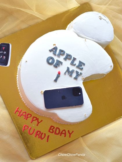 A fun cake for an Apple lover, shaped like the Apple logo. This Choco Mousse cake is decorated with an iPhone, AirPods, and a car key.