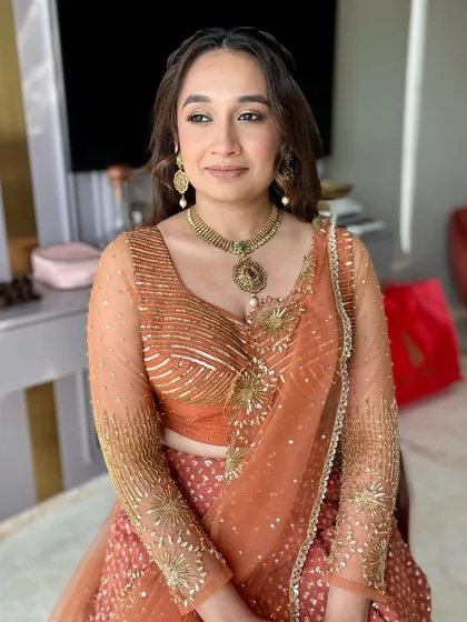 The soft glam makeup enhances her features beautifully, making her look effortlessly stunning for the Garba night.