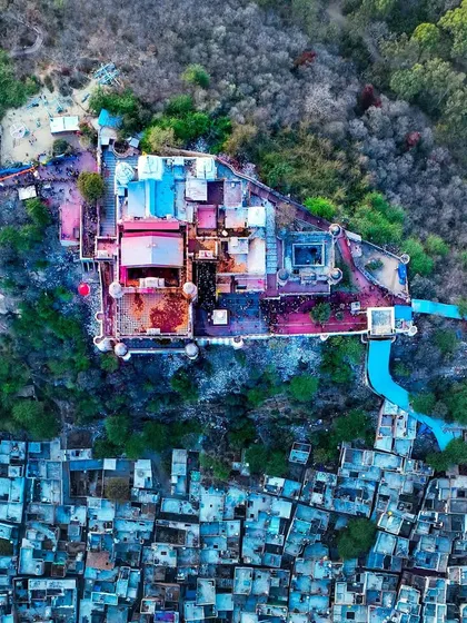 A top-down view of a temple in Barsana, showing its unique architecture and the surrounding settlement.