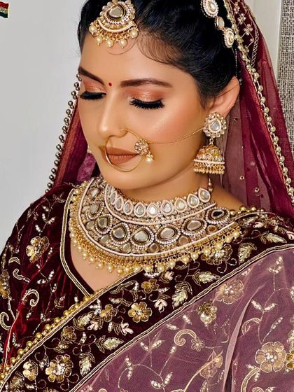 This bride opted for a soft glam look with her velvet lehenga. I used warm, bronze tones on her eyes and a peachy nude lipstick to create a gentle yet stunning appearance.