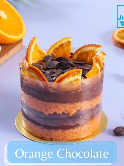 A classic flavor combination, Orange and Chocolate, in a mini dessert form. This treat has layers of zesty orange-infused sponge and rich chocolate mousse, topped with chocolate chips and a candied orange slice.