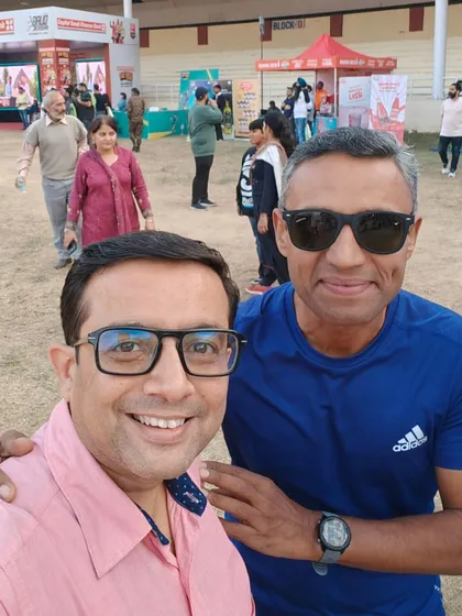 A selfie with a fellow runner at the bib expo. The pre-race excitement is a big part of the experience.