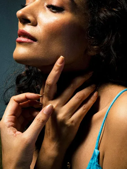 A detailed close-up focusing on gesture and expression. This shot of Dipannita Sharma highlights the subtle beauty in fine art portraiture.