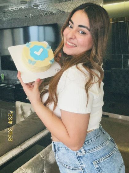 The lovely MissMcBlush posing with her custom celebration cake.