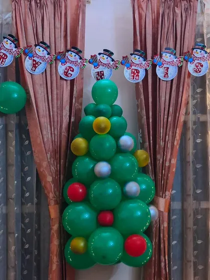 A closer look at the unique balloon Christmas tree we created for a private home celebration. It's a fun and modern alternative to a traditional tree, perfect for adding a pop of color and festive cheer to any room.