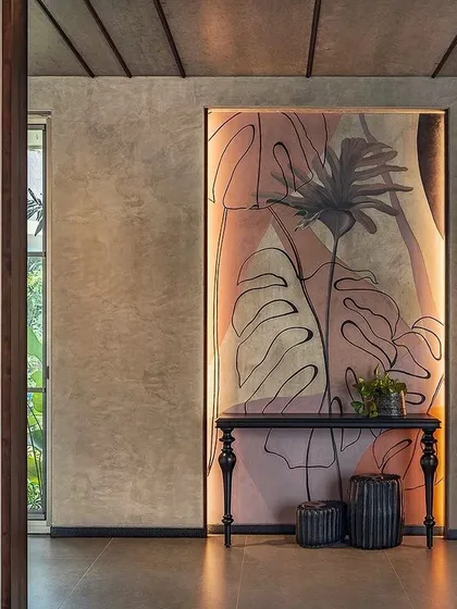Art can define an entryway. This concept uses a large, backlit panel with a modern botanical illustration to create a dramatic focal point, demonstrating the power of integrating large-scale art into an architectural space.