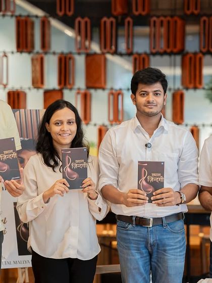 Author Rameshwar Jaiswal with his family and friends, holding his new book "Khayaal Zindagi." We celebrate these milestones with you.