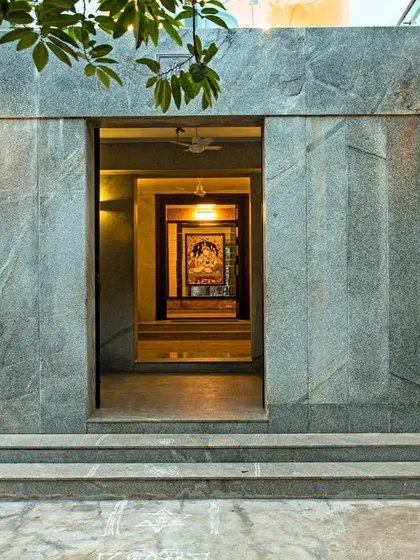 A grand entrance sets the tone for the entire home. For the Eco Terre project, we designed a powerful stone-clad entryway that frames a view through the house, creating a sense of arrival and hinting at the modern, open spaces within.