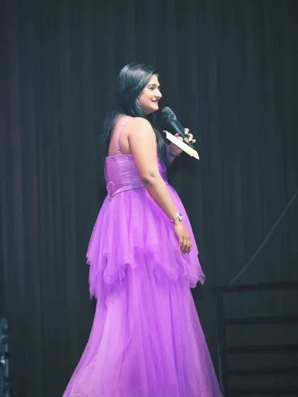 Just another day of lighting up the room in this lovely purple gown. The right color can make all the difference.