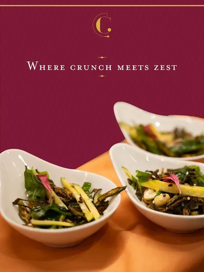 A unique salad of crispy fried okra (bhindi) tossed with slivers of tangy raw mango. This dish offers a delightful play of textures and a zesty, unexpected flavour profile.