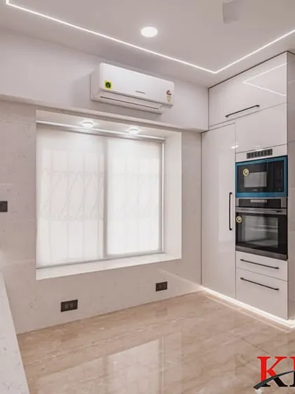 The corner of the U-shaped kitchen, showing the seamless cabinetry and the placement of the air conditioning unit.
