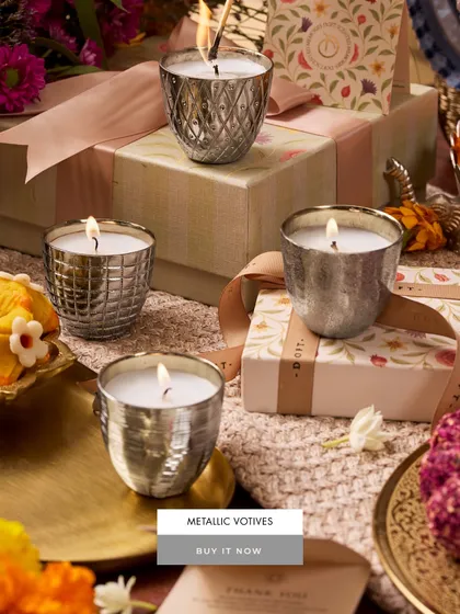 Gifts that glow in the moment. These metallic votives, with their intricate, coin-like patterns, make for a stunning and thoughtful present, beautifully packaged and ready to delight.