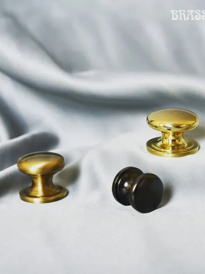 The Baleno Knob is a study in classic simplicity. Pictured here in three different finishes, this furniture knob is a testament to timeless design. Its clean, rounded form makes it a perfect fit for both traditional and contemporary furniture.