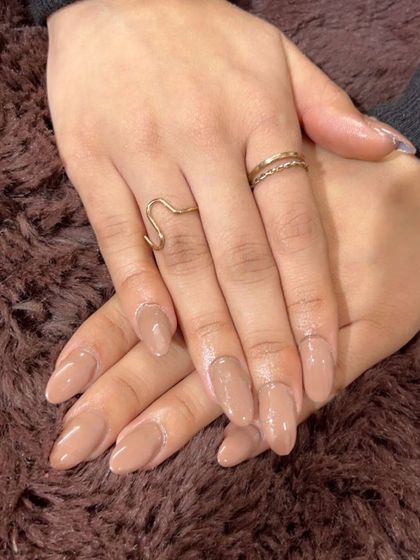 A beautiful, creamy nude on almond-shaped nails. This is a go-to color for a clean, put-together look.