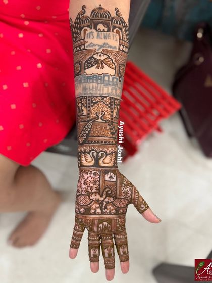 A side view of the arm, focusing on the beautiful quote and the intricate patterns surrounding it.