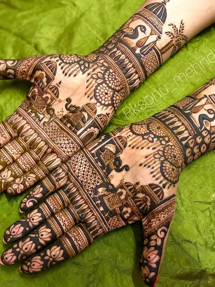 I love creating exquisite, full-coverage bridal mehndi. This traditional design features classic motifs like majestic elephants and graceful peacocks, all intricately detailed to adorn the bride's hands on her special day.
