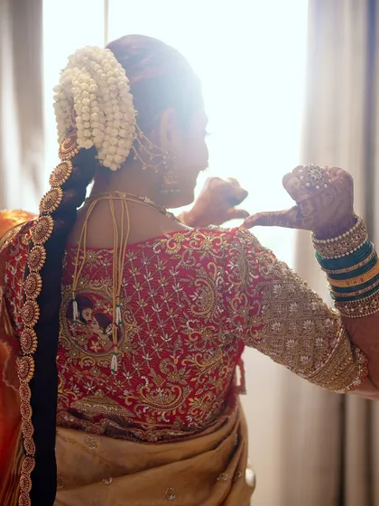 A back view of Sonal's bridal blouse, showcasing the detailed embroidery that covers the entire surface. Every element was designed to create a truly royal look.