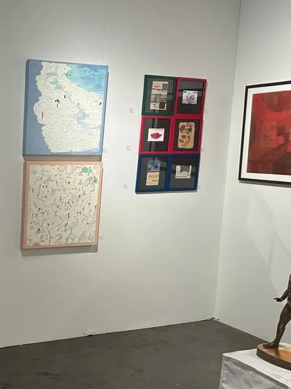A corner of our Seattle Art Fair booth, featuring a sculpture by Cop Shiva and mixed media works.