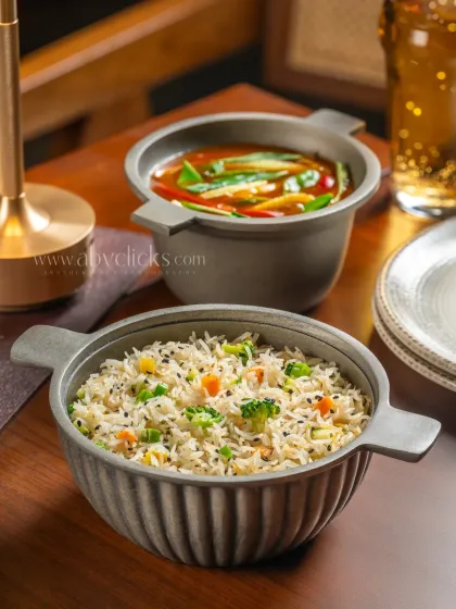 A meal of fried rice and a vegetable gravy dish from Camo, Noida.