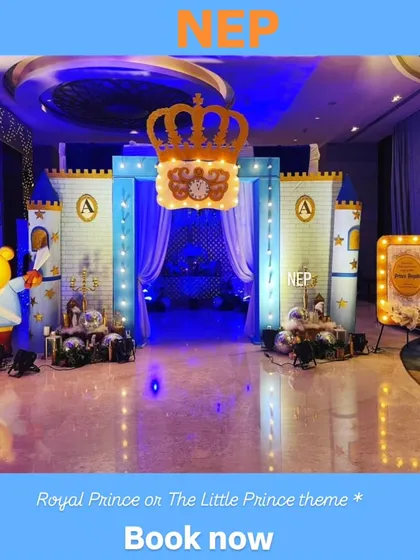 We use dramatic lighting and custom props like this large crown and castle facade to create an impressive royal prince party entrance.