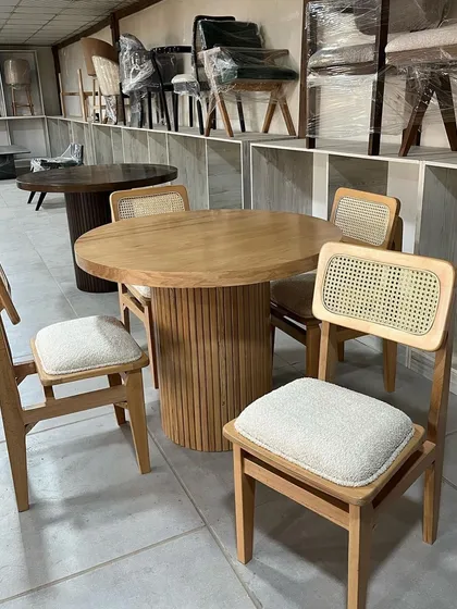 Another angle of the round dining set, showing the details of the chair construction.