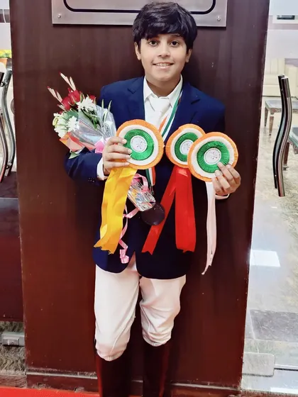 Our superstar rider Yug Shokeen with his collection of medals and ribbons from the Junior National Equestrian Championship. A truly outstanding performance.