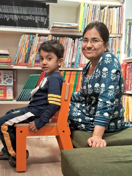 A quiet moment of connection between a mother and her son. Our store is a welcoming space for families to relax.
