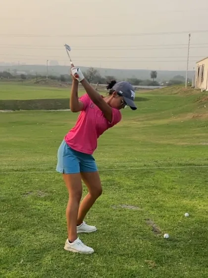 This player demonstrates great rotation and width at the top of her backswing.