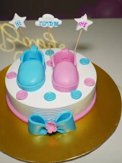 Another angle of the cute gender reveal cake, ready for the party. We take multiple shots of key elements like the cake.